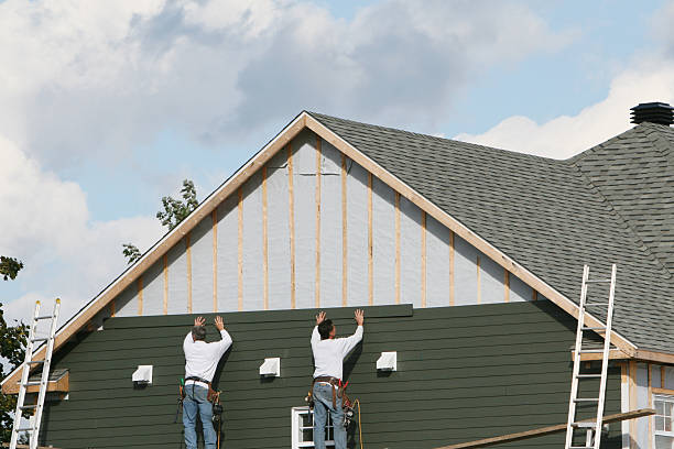 Professional Siding technician working in West College Corner, IN